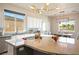 A modern kitchen features a central island with sleek countertops and a view of the dining area at 5130 Agio Ave, Pahrump, NV 89061