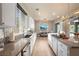Bright kitchen with stainless steel appliances and view into the backyard at 5130 Agio Ave, Pahrump, NV 89061