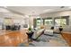Spacious living room showcasing an open floor plan with kitchen access and a lake view at 5130 Agio Ave, Pahrump, NV 89061