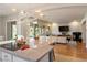 A modern living room extends from the kitchen with natural light and open space at 5130 Agio Ave, Pahrump, NV 89061