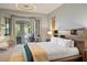 Comfortable main bedroom featuring a sliding glass door leading to a balcony at 5130 Agio Ave, Pahrump, NV 89061