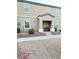 Tan two-story house with a small front porch at 5197 Silica Chalk Ave, Las Vegas, NV 89115