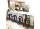 Kitchen island with seating for three at 5197 Silica Chalk Ave, Las Vegas, NV 89115
