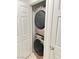 Stackable washer and dryer in laundry closet at 5197 Silica Chalk Ave, Las Vegas, NV 89115