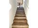 Modern stairs with wood-look laminate risers at 5197 Silica Chalk Ave, Las Vegas, NV 89115