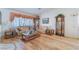 Light and airy living room with hardwood floors and a large window at 585 Duran St, Henderson, NV 89015