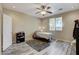 Cozy bedroom with wood-look floors and ceiling fan at 7032 N Albatross Attic St, North Las Vegas, NV 89084