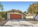 Charming single-story home features a two-car garage, desert landscaping, and tile roof at 7277 Abbeyville Dr, Las Vegas, NV 89119