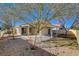 Landscaped backyard with covered patio at 7300 Mountain Thicket St, Las Vegas, NV 89131