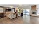 Bright living room featuring hardwood floors, fireplace, and sliding doors to the pool at 8940 Sailplane Ave, Las Vegas, NV 89129