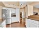 Spacious kitchen featuring stainless steel appliances, hardwood floors, and lots of counter space at 928 Carmel Shores Dr, Las Vegas, NV 89128