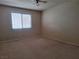 Spacious bedroom with neutral walls and carpeting at 6653 W Tropicana Ave # 101, Las Vegas, NV 89103