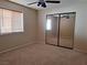 Bedroom with mirrored closet doors and neutral decor at 6653 W Tropicana Ave # 101, Las Vegas, NV 89103