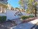 Casa Mesas Villas building exterior, featuring Spanish-style architecture and landscaping at 6653 W Tropicana Ave # 101, Las Vegas, NV 89103