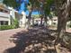 Landscaped grounds with mature trees and gravel pathways at 6653 W Tropicana Ave # 101, Las Vegas, NV 89103