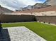 Small backyard with artificial turf and pavers at 10766 Wild Parsley Ave, Las Vegas, NV 89129