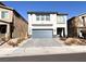 Two-story house with gray siding and a two-car garage at 10766 Wild Parsley Ave, Las Vegas, NV 89129