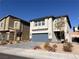 Two-story house with gray siding and a two-car garage at 10766 Wild Parsley Ave, Las Vegas, NV 89129