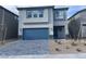 Two-story house with gray siding and a two-car garage at 10766 Wild Parsley Ave, Las Vegas, NV 89129