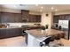 Modern kitchen with granite countertops and stainless steel appliances at 10766 Wild Parsley Ave, Las Vegas, NV 89129