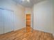 Bedroom with hardwood floors and access to storage at 10840 Villa Torre St, Las Vegas, NV 89141