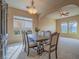 Dining area with a large table, chairs, and natural light at 10840 Villa Torre St, Las Vegas, NV 89141