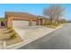 House exterior with driveway and two-car garage at 10840 Villa Torre St, Las Vegas, NV 89141