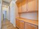 Hallway with built-in wooden cabinets and hardwood floor at 10840 Villa Torre St, Las Vegas, NV 89141