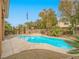 Relaxing pool area with spa and flag at 10840 Villa Torre St, Las Vegas, NV 89141