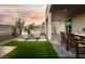 Artificial turf backyard with patio furniture and covered patio at 10965 Cilantro Ave # Lot 108, Las Vegas, NV 89166