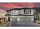 Two-story house with gray siding, three-car garage, and landscaping at 10965 Cilantro Ave # Lot 108, Las Vegas, NV 89166