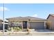 Single-story home with stone accents and a two-car garage at 1170 N Water St, Henderson, NV 89011