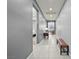 Bright hallway with tile flooring and bench at 1170 N Water St, Henderson, NV 89011