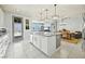 Kitchen island with granite countertop and white cabinets at 1170 N Water St, Henderson, NV 89011