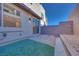 Private backyard with artificial turf and patio at 11935 Glide Reflection Ave, Las Vegas, NV 89138