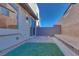 Small, private backyard with patio and artificial turf at 11935 Glide Reflection Ave, Las Vegas, NV 89138