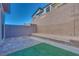 Landscaped backyard with artificial turf at 11935 Glide Reflection Ave, Las Vegas, NV 89138