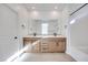 Modern bathroom with double vanity and a large mirror at 11935 Glide Reflection Ave, Las Vegas, NV 89138