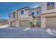 Contemporary townhome showcasing an inviting front entrance and attached garage at 11935 Glide Reflection Ave, Las Vegas, NV 89138