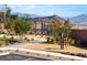 Outdoor fitness area with a view of the mountains, featuring modern exercise equipment and walking paths at 11935 Glide Reflection Ave, Las Vegas, NV 89138