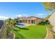 Landscaped backyard with pool and artificial turf at 1343 Panini Dr, Henderson, NV 89052