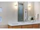 Bathroom with a double vanity and large mirror at 1343 Panini Dr, Henderson, NV 89052