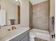 Modern bathroom with soaking tub and grey vanity at 1343 Panini Dr, Henderson, NV 89052