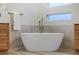 Freestanding soaking tub with gold fixtures at 1343 Panini Dr, Henderson, NV 89052