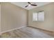 Light and airy bedroom with ceiling fan and wood-look flooring at 1343 Panini Dr, Henderson, NV 89052