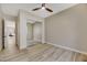 Bright bedroom with mirrored closet doors and wood-look floors at 1343 Panini Dr, Henderson, NV 89052