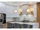 Modern kitchen with a large island and white shaker cabinets at 1343 Panini Dr, Henderson, NV 89052