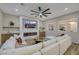 Bright and airy living room with sectional sofa, fireplace, and built-in shelving at 1343 Panini Dr, Henderson, NV 89052