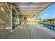 Relaxing patio with pool and sliding glass doors leading to the interior at 1343 Panini Dr, Henderson, NV 89052