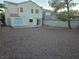 Large backyard with gravel and a two-story house at 1732 Monte Alban Dr, North Las Vegas, NV 89031